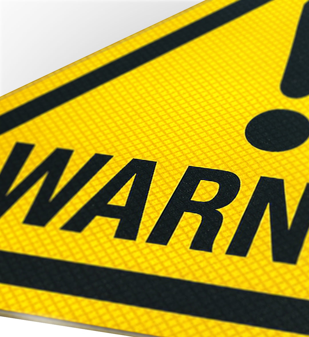 Caution Pinterest inspired aesthetic street sign on a wall.